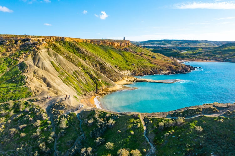 Għajn Tuffieħa, Malta, Europe - Incredible view from the top of the cliff with the sea in the background and beautiful vegetation at Għajn Tuffieħa Bay (Riviera Bay) in Malta, Europe.