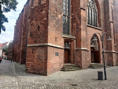 Photo of beautiful panoramic view of historic Bremen Market Square in the center of the Hanseatic City of Bremen with The Schuetting and famous Raths buildings on a sunny day with blue sky in summer, Germany.