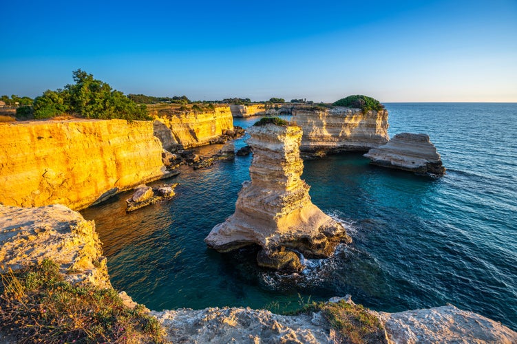 Photo of  dawn of the Faraglioni of S. Andrea, Melendugno, Lecce,Italy.