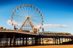 Photo of aerial view of the famous Blackpool Tower and beach on a beautiful Summer day on one of Great Britains most popular holiday destinations, England.