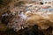 Photo of Unique and rare Ochtinská aragonite cave in the Slovak Karst inscribed on the UNESCO World Heritage List and its mineral.