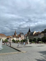 Photo of traditional half-timbered houses on picturesque canals in La Petite France in the medieval fairytale town of Strasbourg, France.