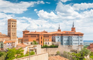 photo of summer view of Teruel with landmarks (Cathedral of Santa María de Mediavilla, Mausoleum of the Amantes) in Aragon, Spain.