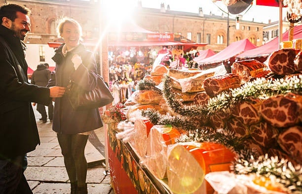 Couple enjoying a festive visit to a Christmas market in Milan.jpg