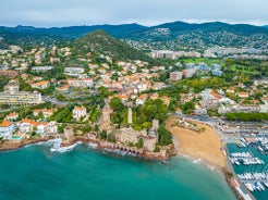 photo of harbor and town of Golfe-Juan Vallauris, commune of the Alpes-Maritimes department, which belongs in turn to the Provence-Alpes-Cote of Azur region of France.