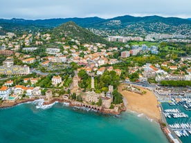 Photo of aerial cityscape view on French riviera with yachts in Cannes city, France.