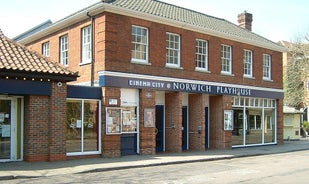 Photo of historic town houses at night on Quay Side in Norwich, Norfolk, United Kingdom.