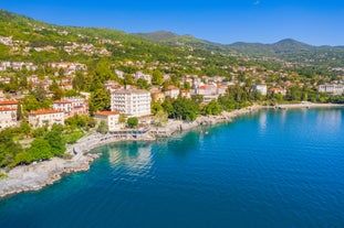 photo of aerial panoramic view of beautiful town of Lovran and sea walkway in Croatia.