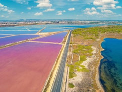 Photo of Beach seashore with wooden path to sea water in San Pedro del Pinatar