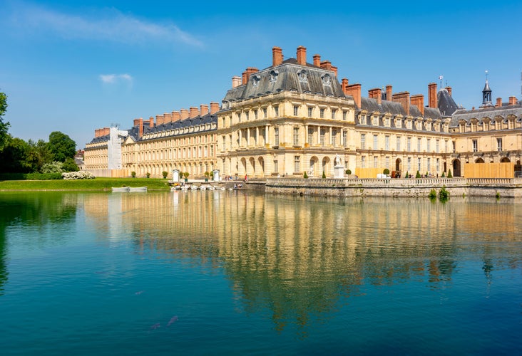 Fontainebleau palace (Chateau de Fontainebleau) and Carp's pond near Paris, France