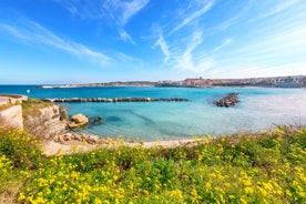 Photo of aerial view of Otranto town in Puglia with crystal turquoise waters, Italy.