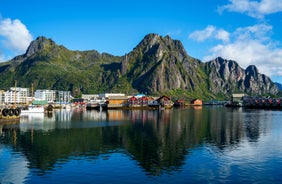 Photo of houses, bridge and panorama of Norwegian city Tromso beyond the Arctic circle from mountain in Norwegian fjords.