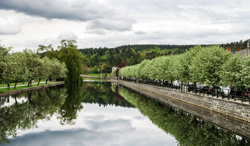 photo of view of Small village landscape with calm river, Han-sur-Lesse, Belgium.