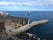 ancient coal pier, cais do carvão madeira island, hotel zone on the background