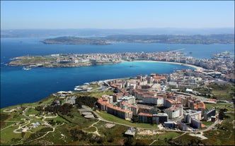 Photo of aerial panoramic view of Lugo galician city with buildings and landscape, Spain.