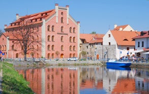 Photo of Lednice Chateau with beautiful gardens and parks on a sunny summer day, Czech Republic.