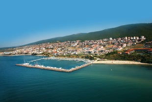 Photo of panoramic aerial view over small ancient resort town of Pomorie with old European small houses , Bulgaria.