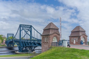 Photo of beautiful panoramic view of historic Bremen Market Square in the center of the Hanseatic City of Bremen with The Schuetting and famous Raths buildings on a sunny day with blue sky in summer, Germany.