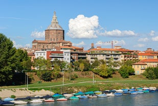 Photo of aerial view of Pavia and the Ticino, Cathedral of Pavia and Covered Bridge, Italy.