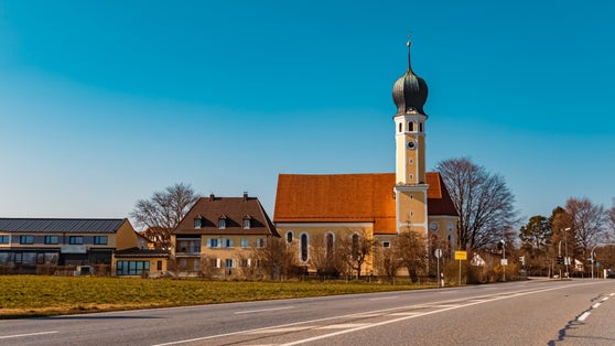 Beautiful church with a cloudless blue sky at Rosenheim, Bavaria, Germany