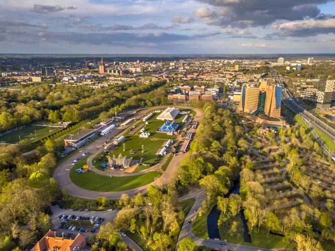 Aerial View of Groningen city Skyline from main park Stadspark area with festival builing up on racetrack event grounds, Netherlands