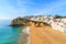 Photo of Carvoeiro fishing village with beautiful beach and colourful houses, Portugal.