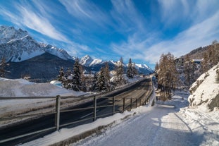 Photo of  beautiful Scuol town in Swiss Alps and Inn river, Switzerland.