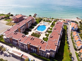 Photo of panoramic aerial view over small ancient resort town of Pomorie with old European small houses , Bulgaria.