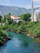 Photo of aerial view of the old bridge and river in city of Mostar, Bosnia and Herzegovina.