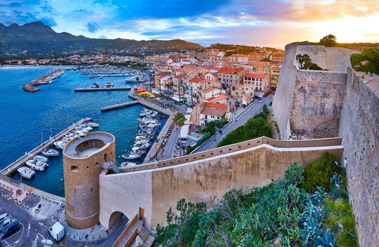 View from the walls of the citadel of Calvi on the old town with historic buildings.