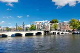 Amsterdam Netherlands dancing houses over river Amstel landmark in old european city spring landscape.