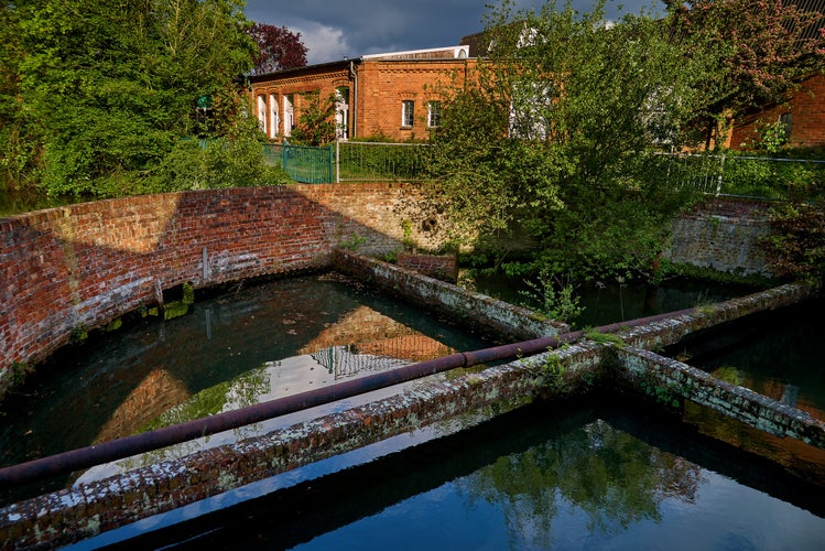 Photo of round water basin as part of the historic spinning and dyeing mill in Delmenhorst (Germany).