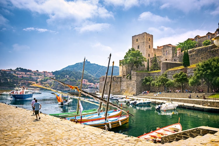 Photo of Royal Castle (The Chateau Royal de Collioure), a massive French royal castle, and the harbour in the town of Collioure, France.