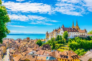 Panoramic view of historic Zurich city center with famous Fraumunster, Grossmunster and St. Peter and river Limmat at Lake Zurich on a sunny day with clouds in summer, Canton of Zurich, Switzerland