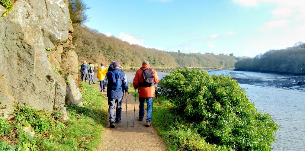 Group of pensioner hikers on a path in Brittany. Lannion France