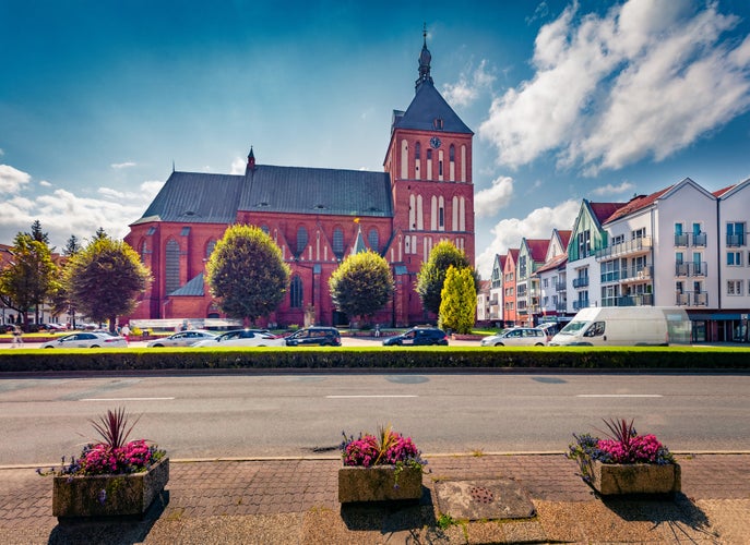 Gorgeous summer view of Koszalin Cathedral, Gothic building erected in the years 1300-1333 as a three-nave basilica. Wonderful morning cityscape of Koszalin town, Western Pomerania, Poland.