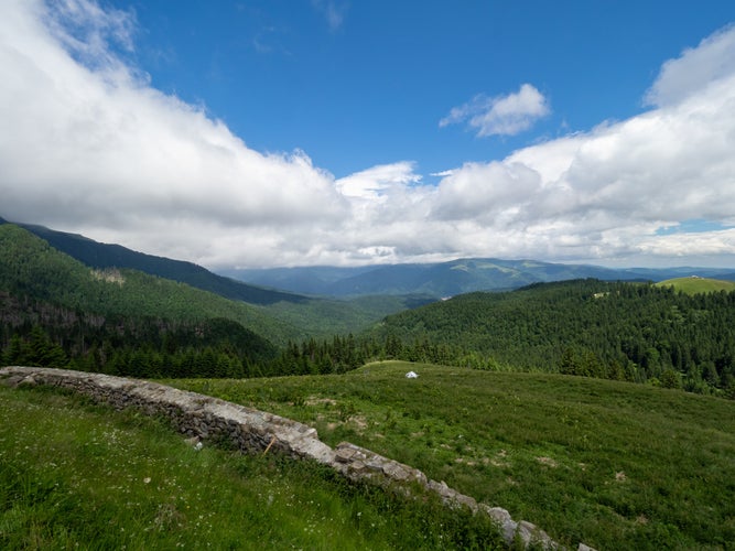 photo of view of Moroeni, Romania - July 04 2021: Bucegi mountains. A view of Bucegi mountains from the DJ 713 road.