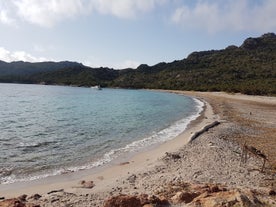 Photo of amazing landscape with wooden pier on Santa Giulia beach, Porto-Vecchio ,France.