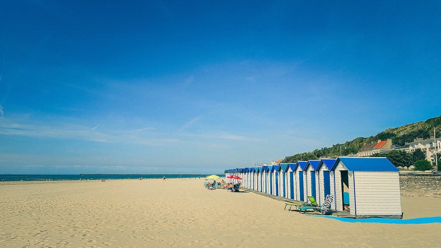 Row of white and blue beach huts at Boulogne-sur-Mer, Pas-de-Calais, France