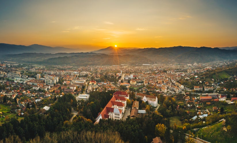 Photo of aerial view of Petrosani city at sunset in Hunedoara, Transylvania, Romania.