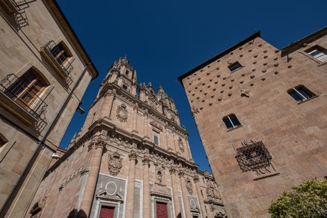 Photo of Church of the Holy Spirit (Clerecía) and Casa de las Conchas, Salamanca, Spain .