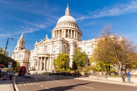 London, England - Panoramic skyline view of Bank and Canary Wharf, central London's leading financial districts with famous skyscrapers at golden hour sunset with blue sky and clouds.