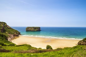 Photo of Ballota beach with the islet Castro, Llanes,  Spain.