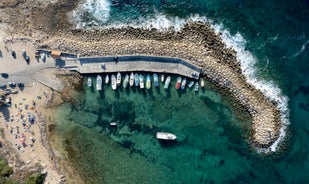 Photo of aerial view on clear blue water of Coral bay in Peyia, Cyprus.