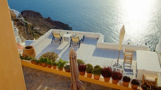 Photo of beautiful White architecture of Oia village on Santorini island, Greece.