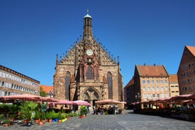 Photo of aerial view of the historic city center of Freiburg im Breisgau from famous old Freiburger Minster in beautiful evening light at sunset, Germany.