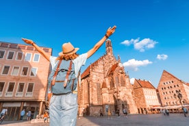 Photo of scenic summer view of the German traditional medieval half-timbered Old Town architecture and bridge over Pegnitz river in Nuremberg, Germany.