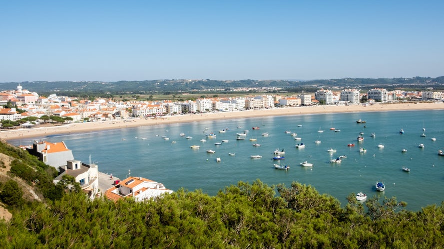 Photo of S. Martinho do Porto, Portugal - September 20, 2018 : Nearly closed sea bay, fine sand beach and clear water Alcobaca, Portugal.