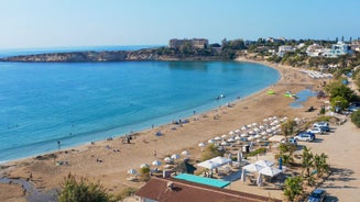 Photo of aerial view on clear blue water of Coral bay in Peyia, Cyprus.