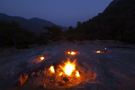 photo of natural fires on the slopes of Mount Chimera at night in Antalya, Turkey.